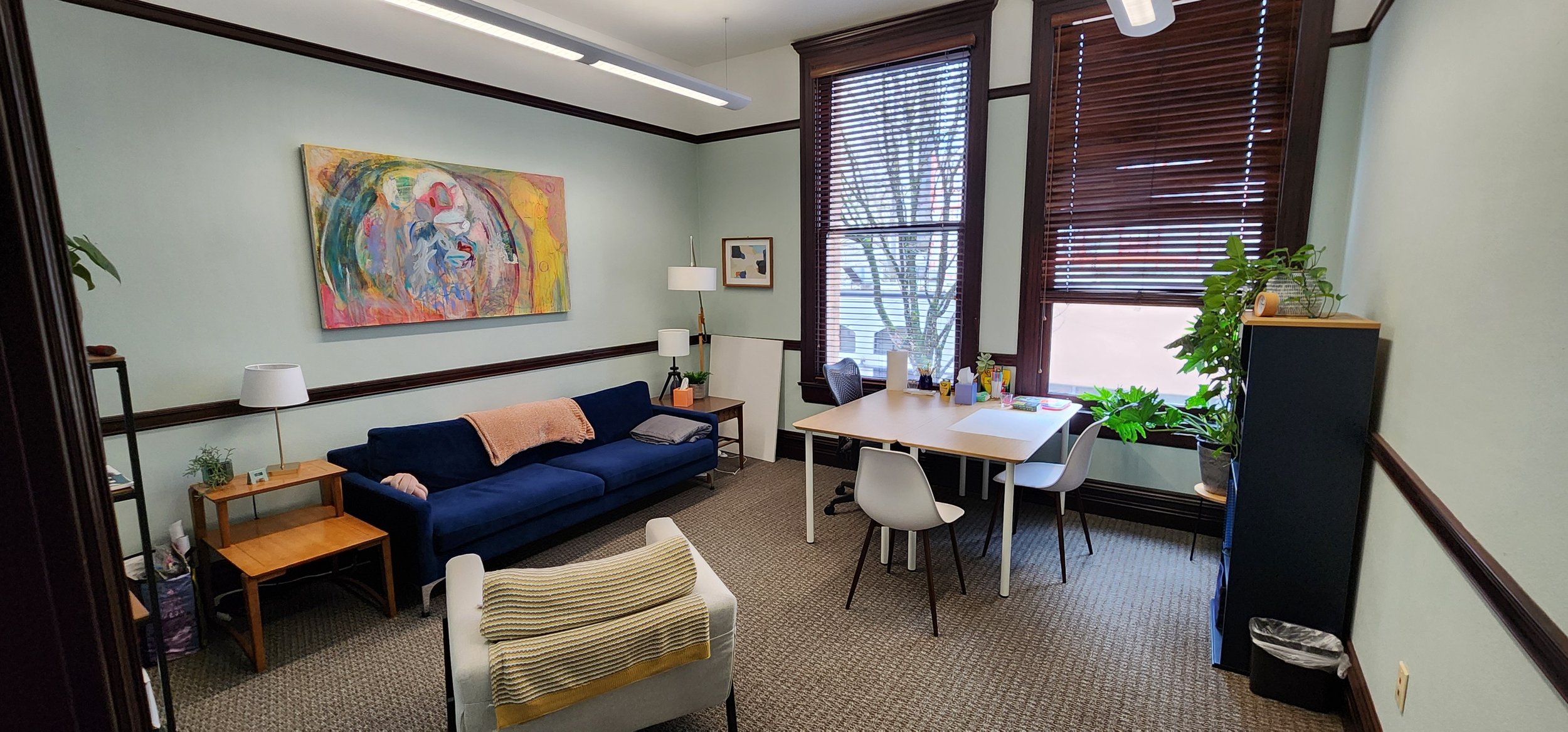 Therapy office with seating and tall window