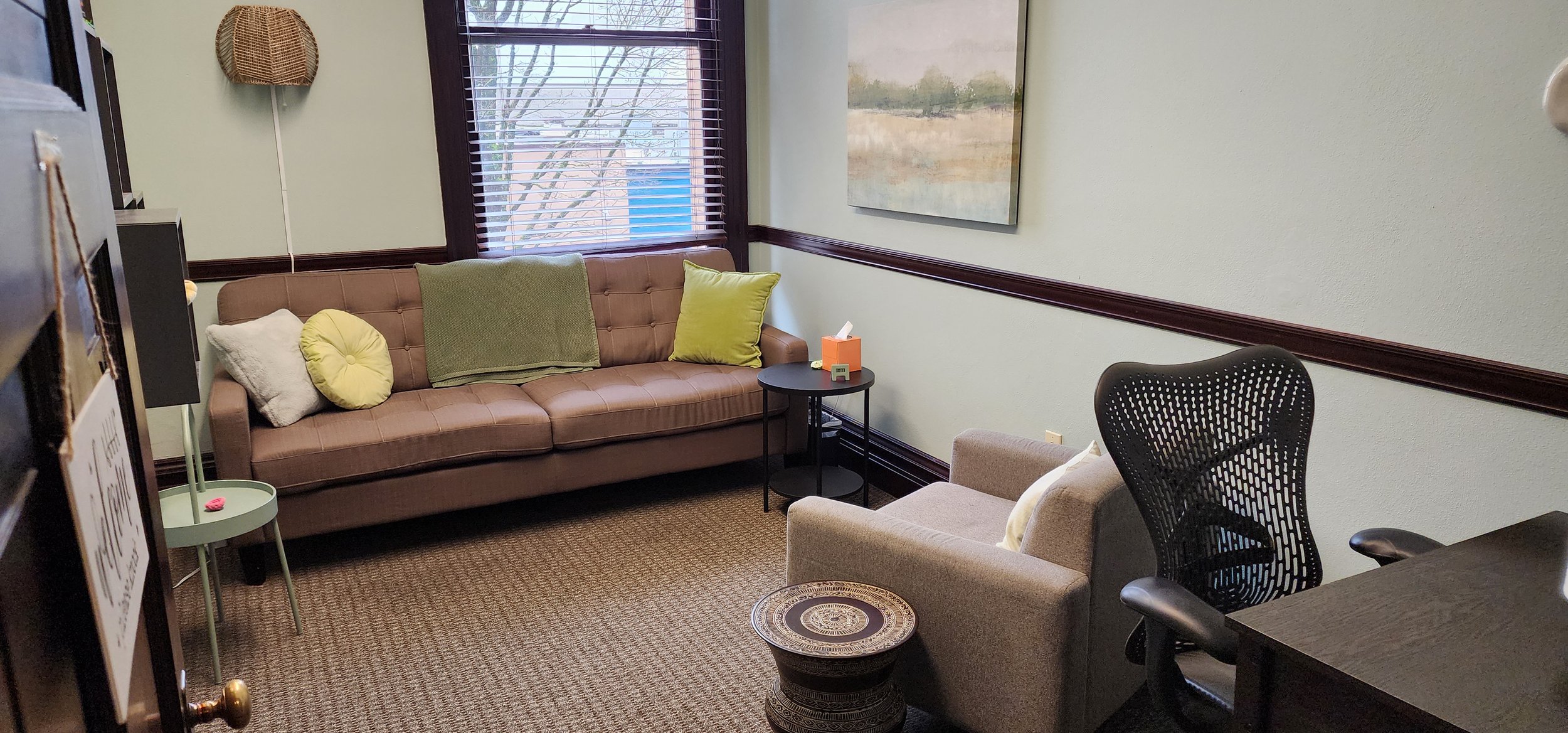 Art therapy room with materials and work surfaces