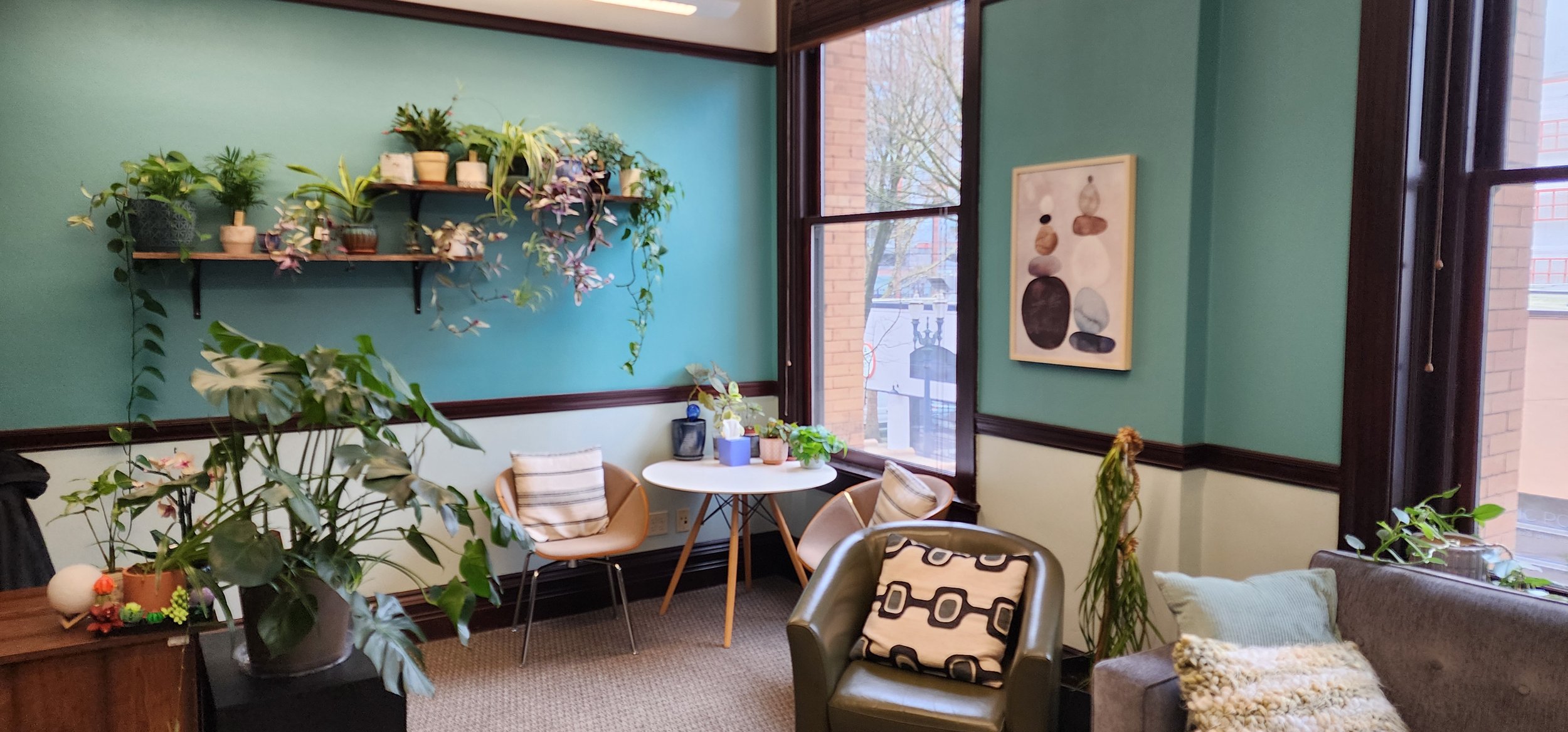 Art therapy office with colorful supplies and windows